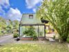 Einfamilienhaus mit Wintergarten und Teilunterkellert - Hausansicht-Wintergarten