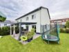 Moderne Doppelhaushälfte mit Terrasse, Fernwärme und zwei Stellplätzen in Velten - hintere Hausansicht