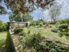 Einfamilienhaus im Bungalowstil, Vollkeller und großem Grundstück - Gartenansicht